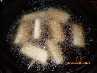 Fry the yuca sticks in very hot oil. Fry the yuca sticks in very hot oil.