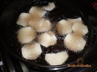 Fry the thinly sliced yucca in very hot oil.