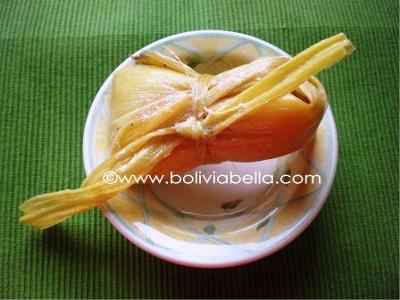 Huminta. Ground white corn and cheese boiled in a tied husk.