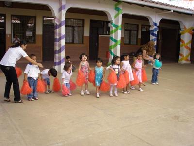 Me with the Prekindergartners about to present their English song to the rest of the school