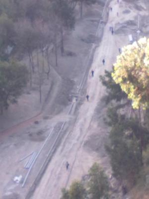 People walking under the bridge